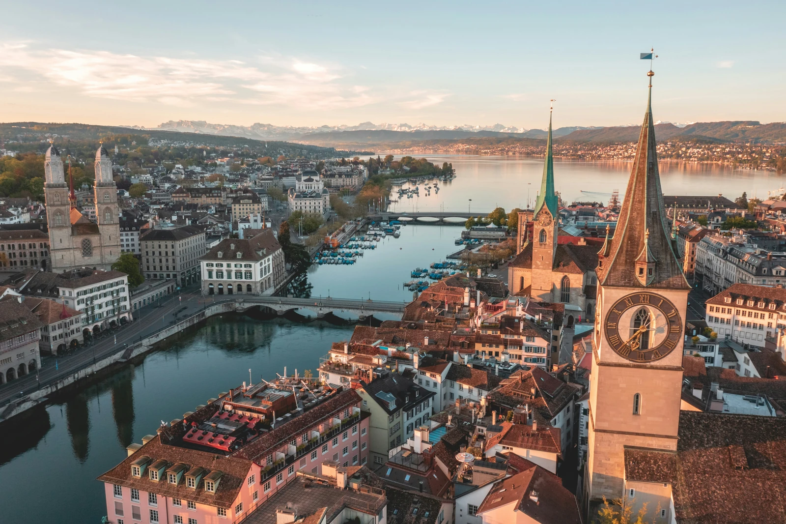 Zurich and its lake framed by mountains in warm light